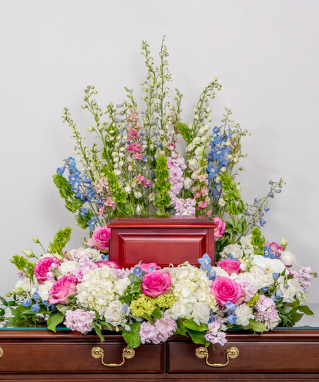 memorial wreath of all soft pink, white, and lavender flowers