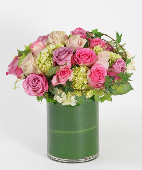 lavender, peach and pink roses accented with white hydrangea