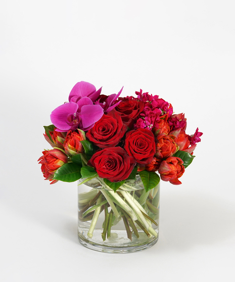 Valentine's Day arrangement featuring red roses, burgundy orchids and pink hydrangea